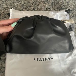Understated Leather Crescent Clutch